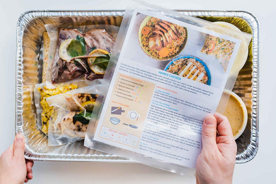 A tin tray holding the ingredients to make Hanoi chicken.