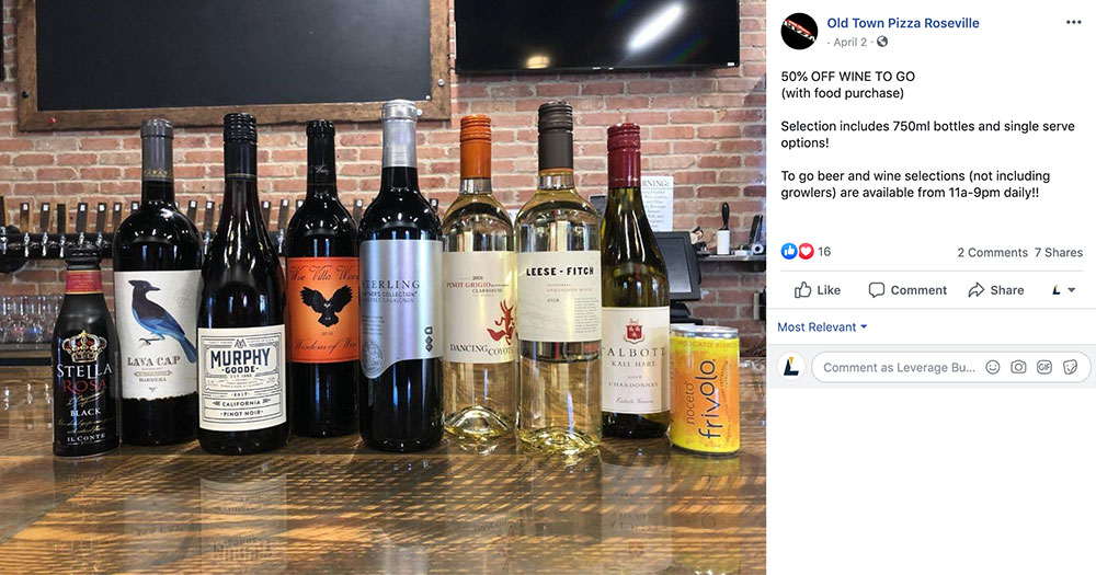A post from Old Town Pizza's Facebook account advertising 50% off wine bottles.